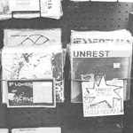 FLOWERS OF DISCIPLINE, UNREST, 7-inch singles on sale at Olsson's Books and Records, Georgetown, Washington, D.C.