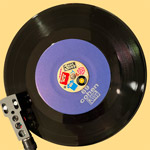 Teenbeat metal 7-inch 45 adaptor, front, with Teenbeat 69 on a phonograph