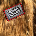 Teenbeat Embroidered Patch on a faux fur coat